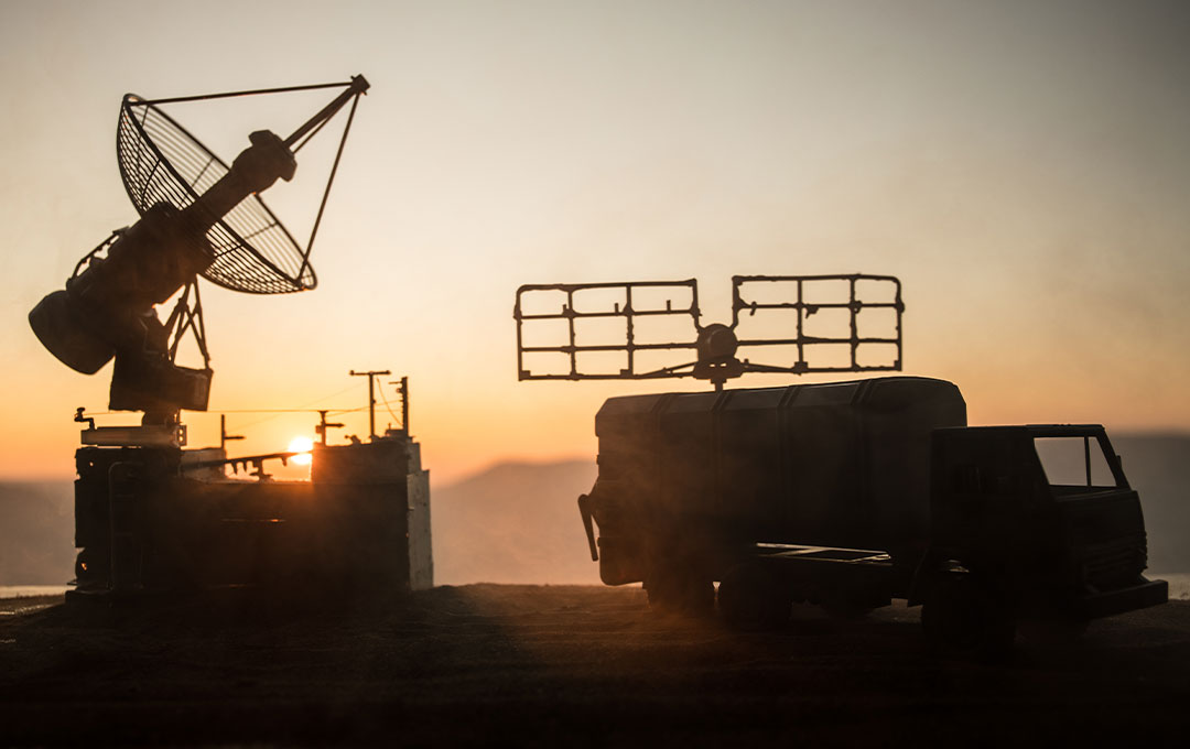 Two military vehicles equipped with communication decives
