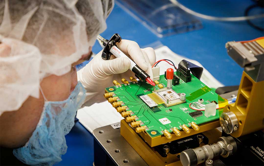 Person soldering a circuit board